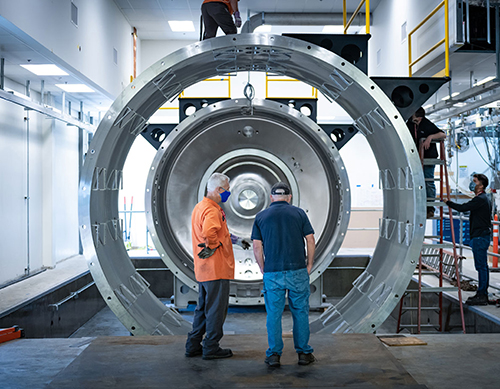 Picture of electric propulsion chamber being installed on campus