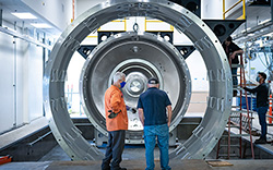 Picture of electric propulsion chamber being installed on campus