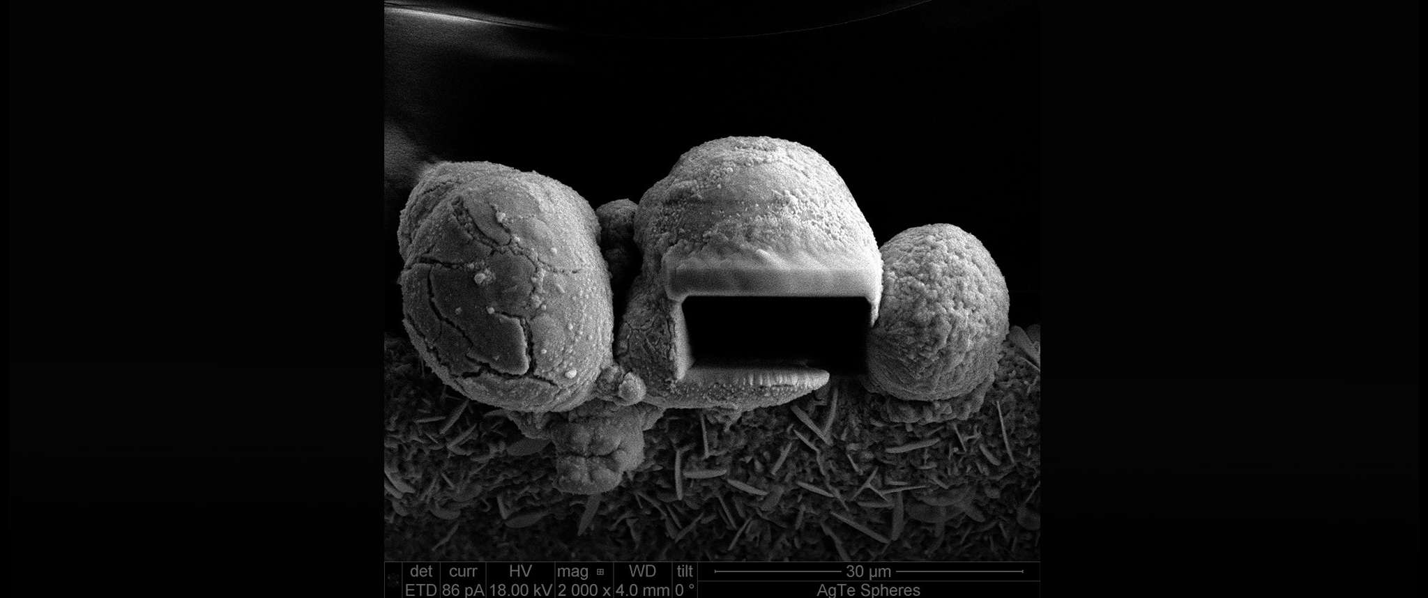 FIB Cut or Marvin the Martian Helmet? Focused ion beam (FIB) cut exposes the interior of one of the many silver telluride spheres that form along a silver edge during a silver surface treatment. Aerospace scientists use an arsenal of analytical techniques to obtain detailed information about micro- and nano-scale structures and their chemical composition.