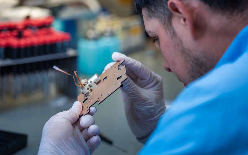 Technician working on AeroCube-10.