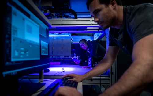 Two people working with solar simulator